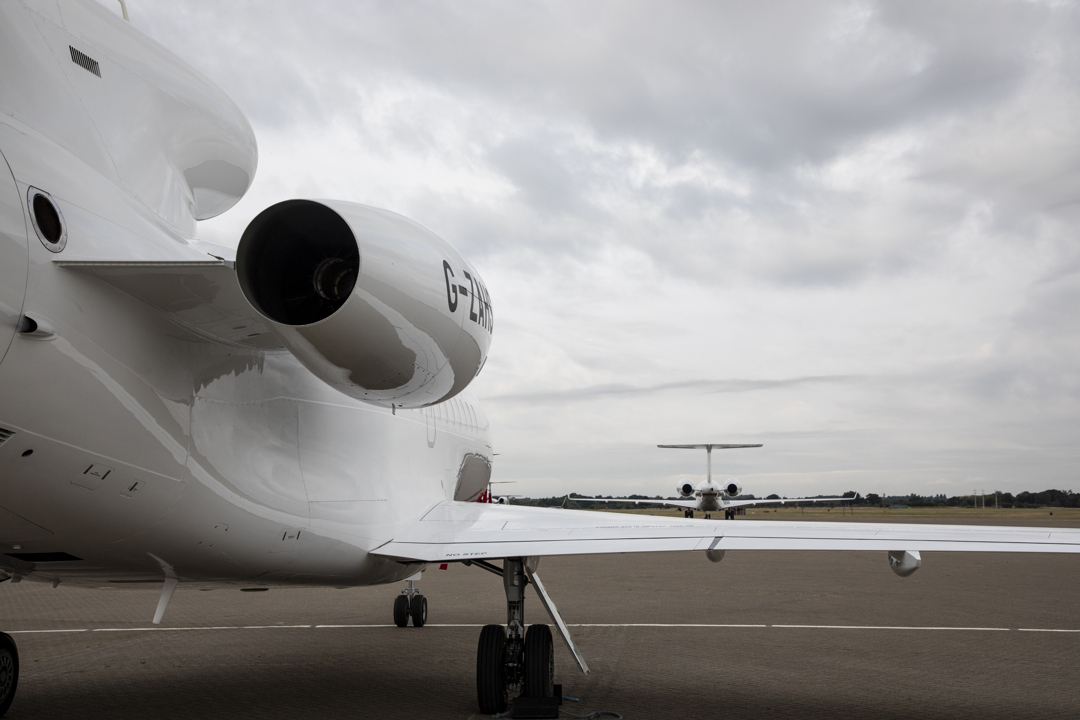 Image shows rear view of the Envoy aircraft on the airfield.